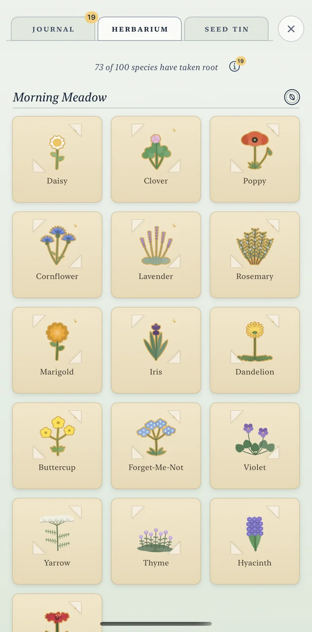 The herbarium: 73 of 100 species have taken root. The Morning Meadow chapter shows pressed daisy, clover, poppy, cornflower, lavender, rosemary, marigold, iris and more.